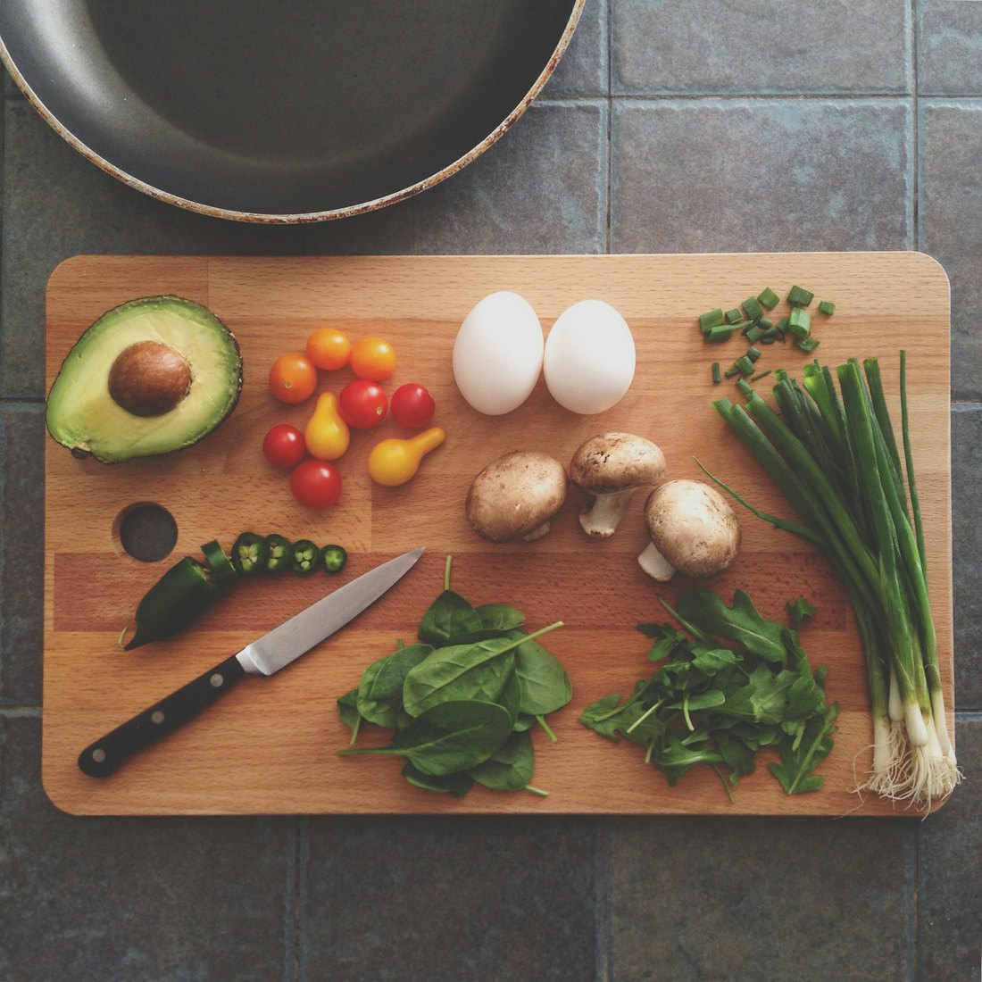 Fresh herbs and vegetables on a cutting board
